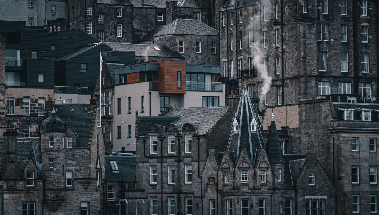 A scenic view showcasing the blend of gothic and modern architecture in Edinburgh, Scotland.